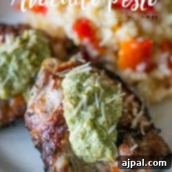 A plate with creamy guacamole on top of grilled chicken.