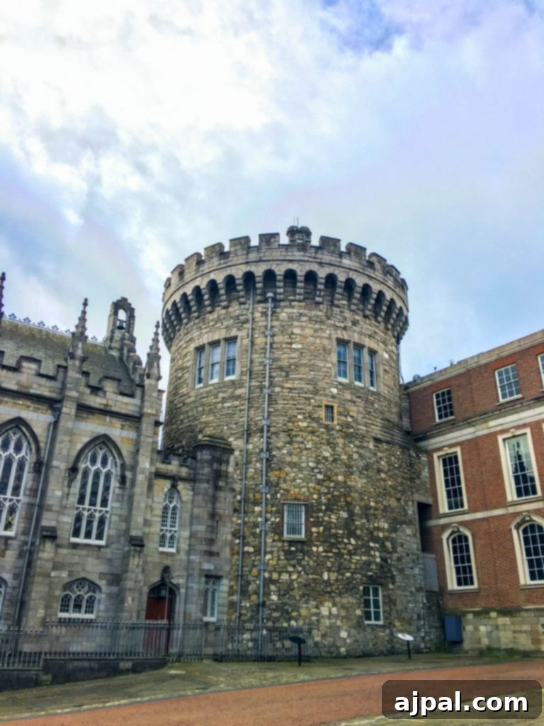 Dublin Awaits Top Reasons and Essential Experiences 15 The picturesque courtyard of Dublin Castle, with historical buildings and a central sculpture.