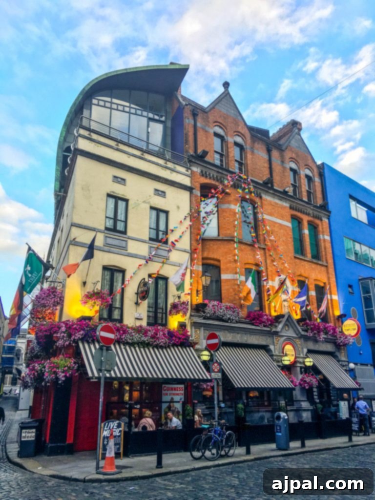 Dublin Awaits Top Reasons and Essential Experiences 33 A charming street scene in Dublin with colorful buildings and a traditional Irish pub, inviting visitors to explore.