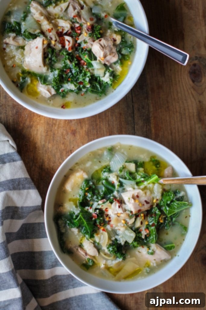30 Cozy Slow Cooker Soups for Fall 7 Crockpot Chicken Artichoke Kale Soup, a healthy and flavorful soup for any day