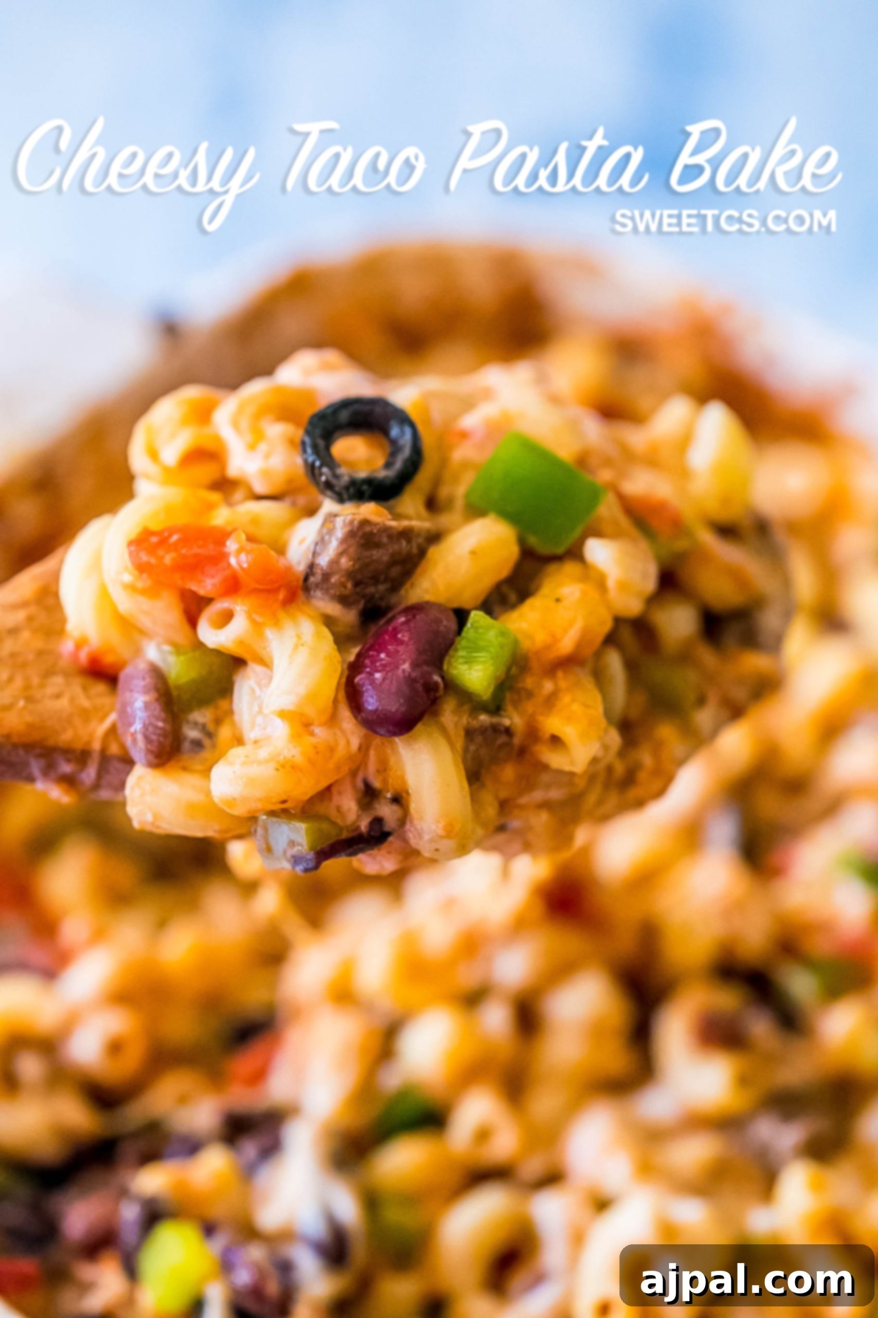 Close-up of the bubbling hot Cheesy Taco Pasta Bake fresh out of the oven, showcasing melted cheese, visible bell peppers, and pasta.