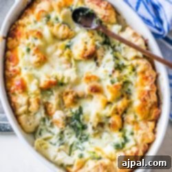 A casserole dish with chicken and spinach.