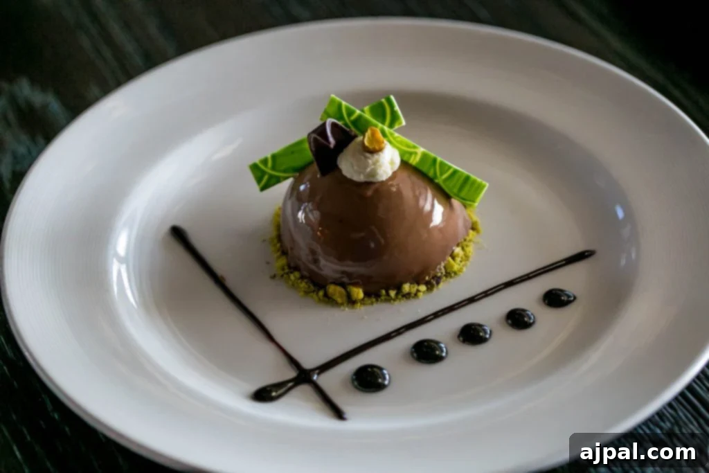 decadent chocolate dome dessert with nuts and cream