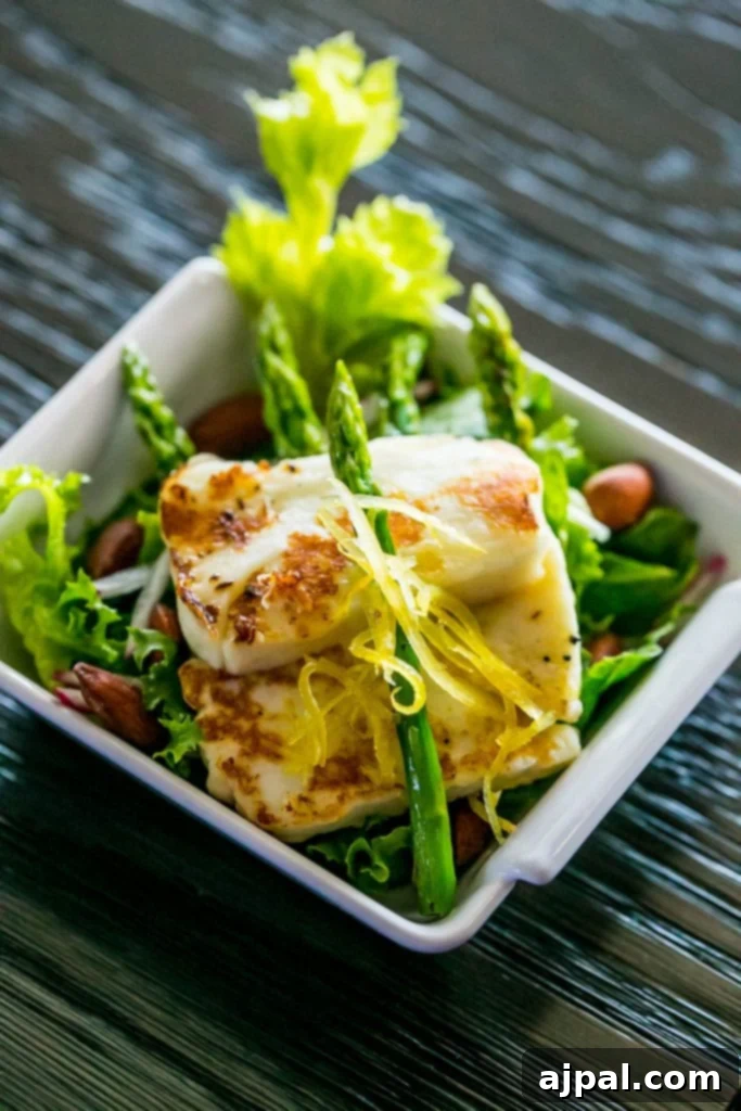 artfully plated salad with fried fish and asparagus