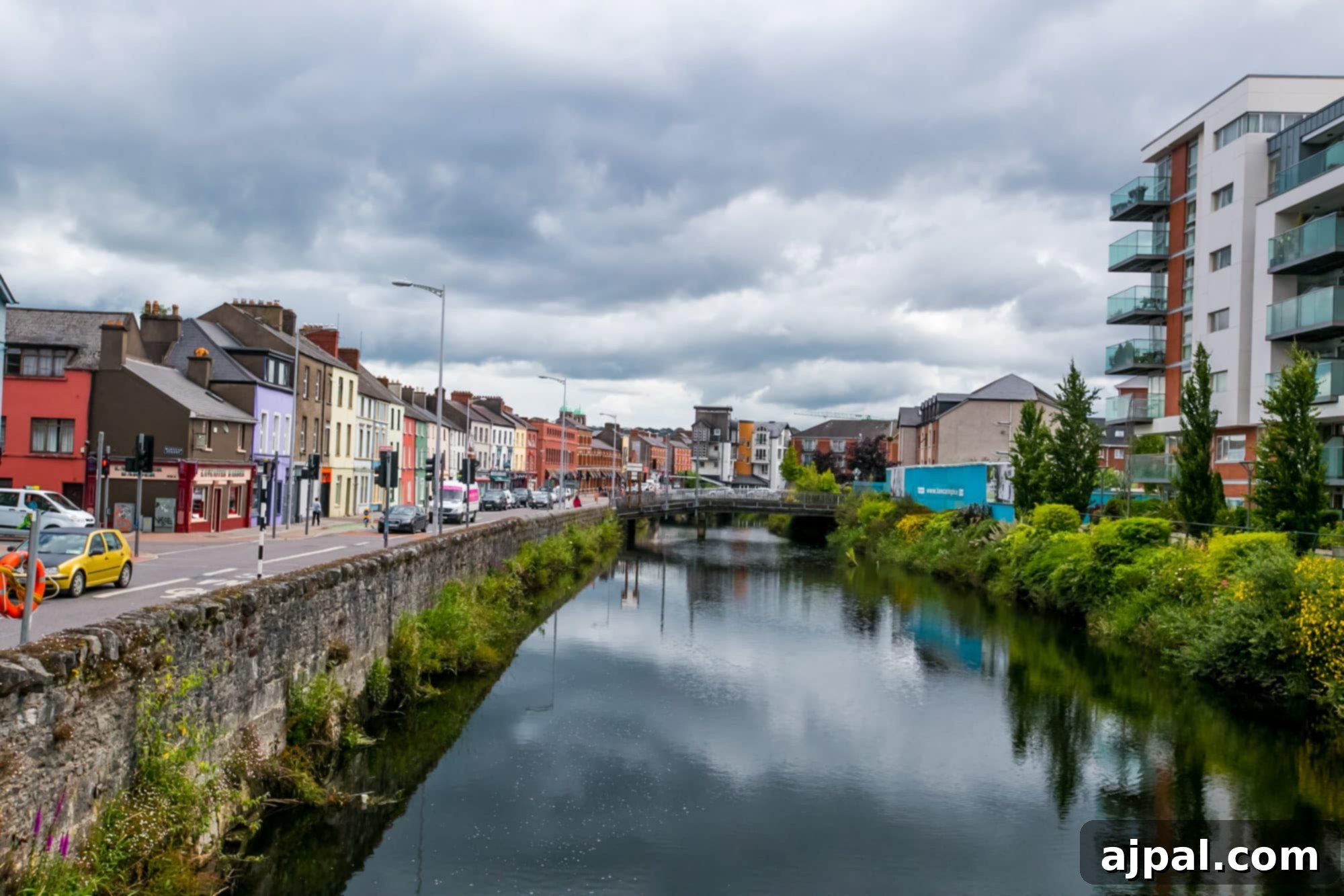 The River Lee flowing through Cork, Ireland, with city buildings on both sides.