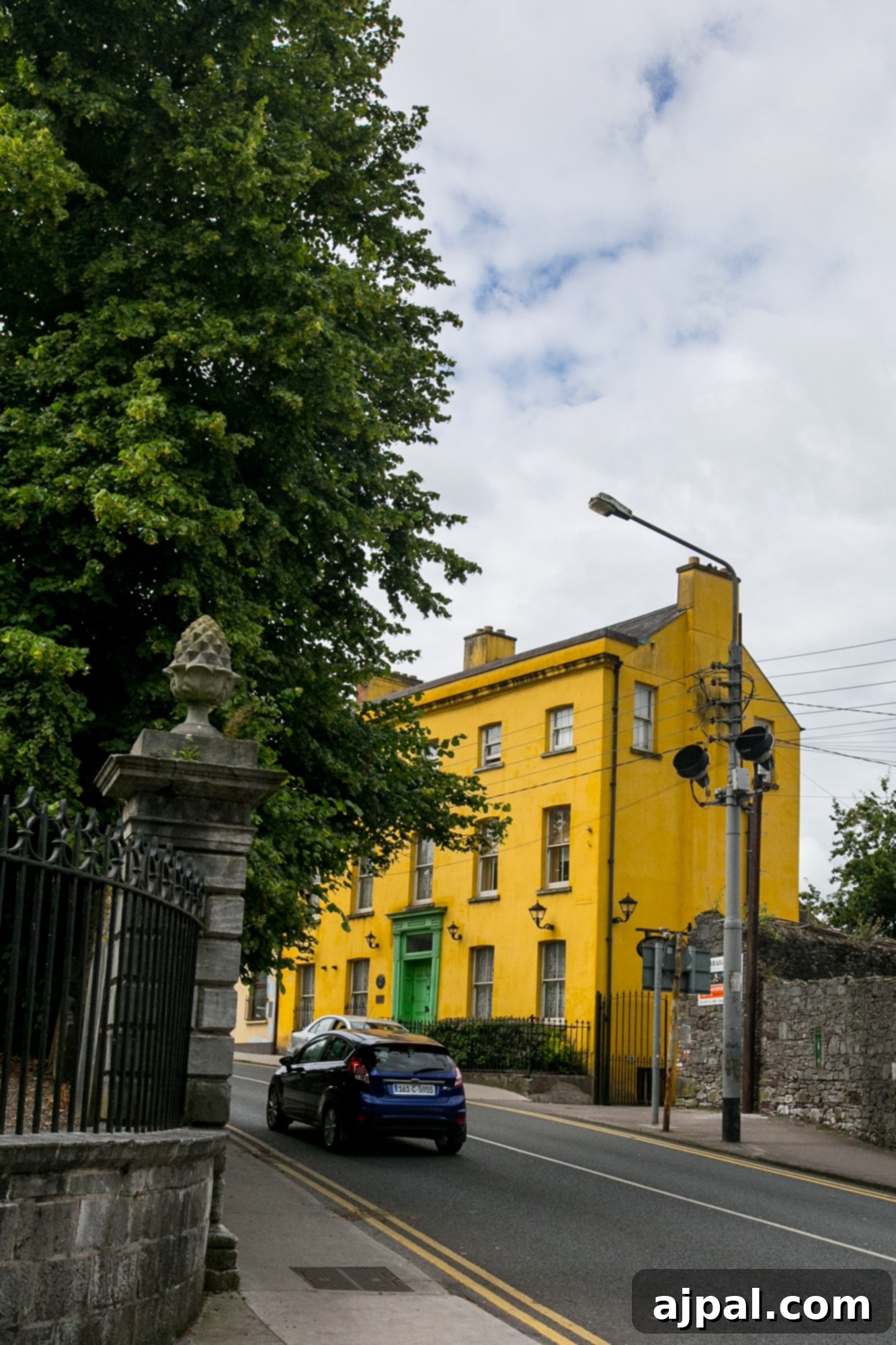 A bright yellow building stands out among Cork's colorful architecture.