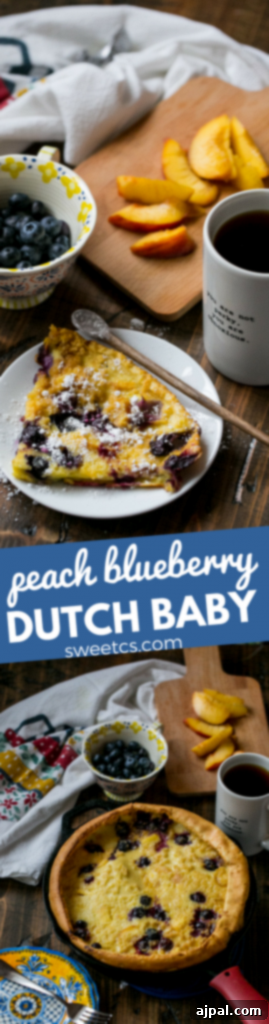 Final plated serving of peach blueberry Dutch baby pancake