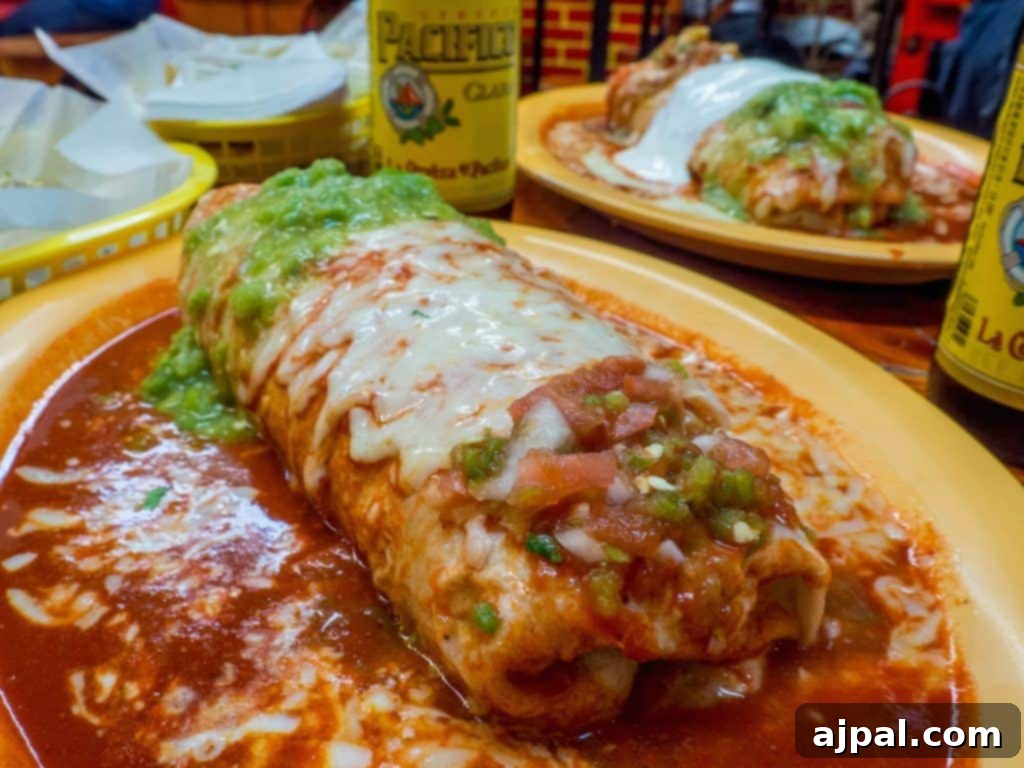 San Francisco: Your 2-Day Adventure 19 Carnitas Mojado Burrito and beer on a table at Taqueria Cancun