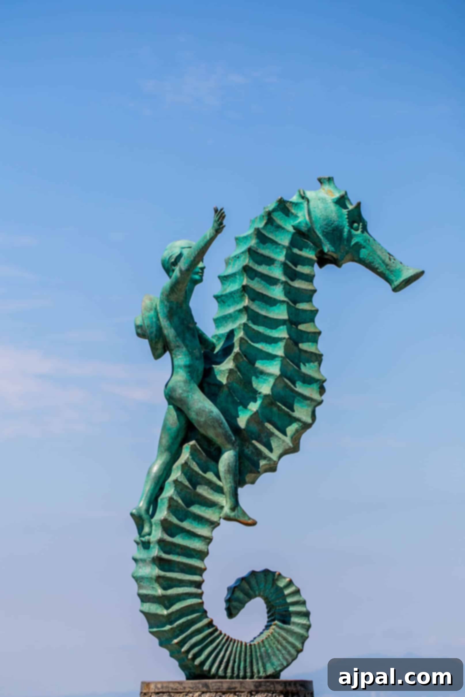 Ruby Princess Unveils Puerto Vallarta 6 green seahorse statue with a boy riding on it