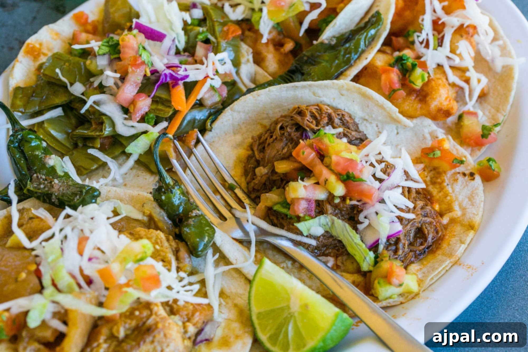 tacos with peppers, pulled pork, and salsa