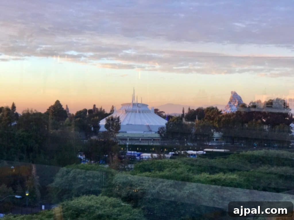 Sunset view of Disneyland from a hotel window at Grand Legacy at the Park