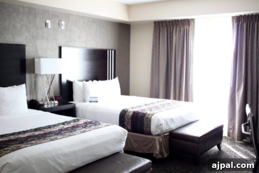 Hotel room with two queen beds at Grand Legacy at the Park