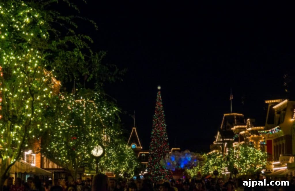 Disneyland at night glowing with Christmas lights