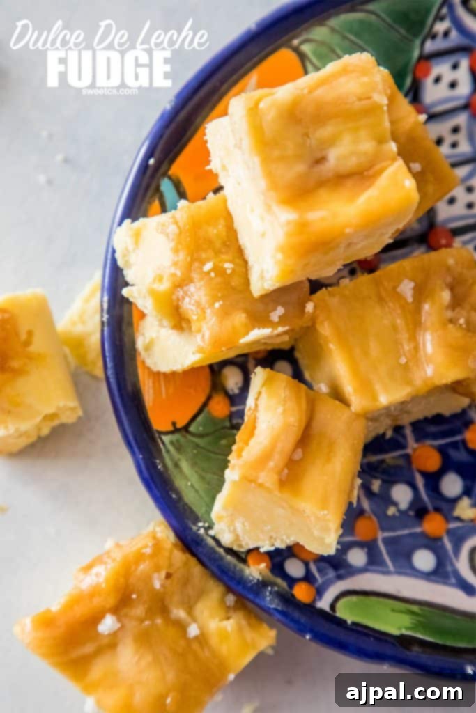 Decadent Dulce De Leche Cake Batter Fudge 5 creamy caramel colored fudge stacked on a plate