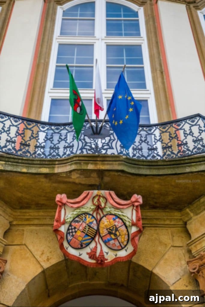 Ksiaz Castle Hotel 7 The grand entrance to Ksiaz Castle in Poland, with flags flying proudly.