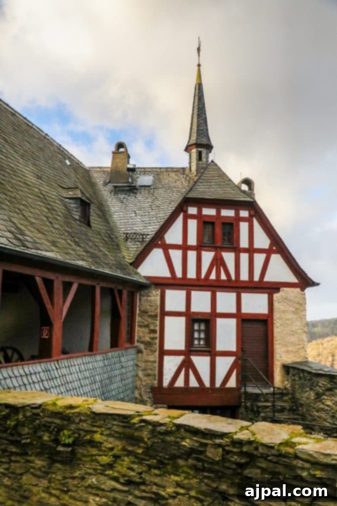 Marksburg Castle: Germany's Best-Preserved Medieval Gem 15 The impressive, steepled wooden architecture of Marksburg Castle, renowned as one of Germany's best-preserved medieval fortresses.