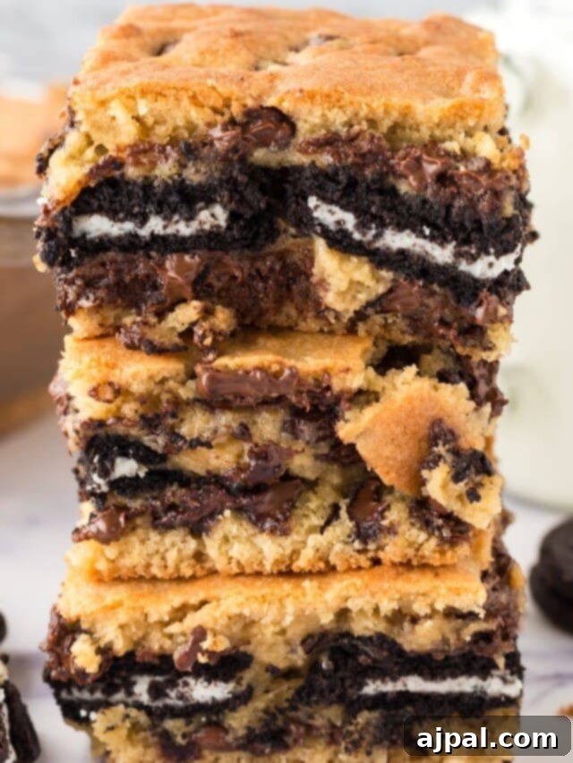 Game Day Feast: 12 Must-Try Dishes 12 Stacked square Oreo cookie bars, revealing layers of chewy cookie, creamy filling, and crushed Oreo pieces, perfect for a sweet game day treat.