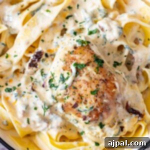 Decadent Creamy Tuscan Chicken Alfredo 13 A creamy tuscan alfredo chicken skillet.