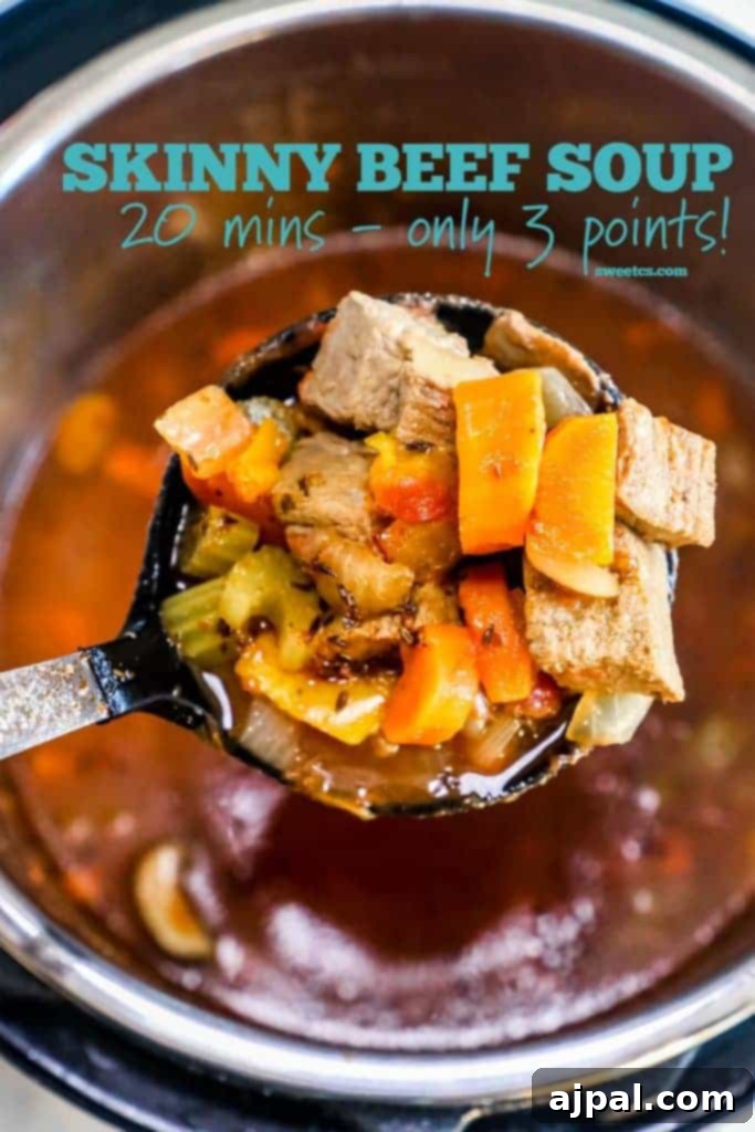 A close-up of a bowl of Instant Pot Skinny Steak Soup, showcasing the generous chunks of beef, vibrant vegetables, and rich broth.
