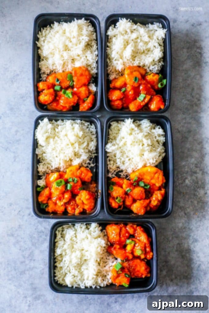 Four plastic meal prep containers with Instant Pot Sweet and Sour Chicken and Rice, ready for the week.
