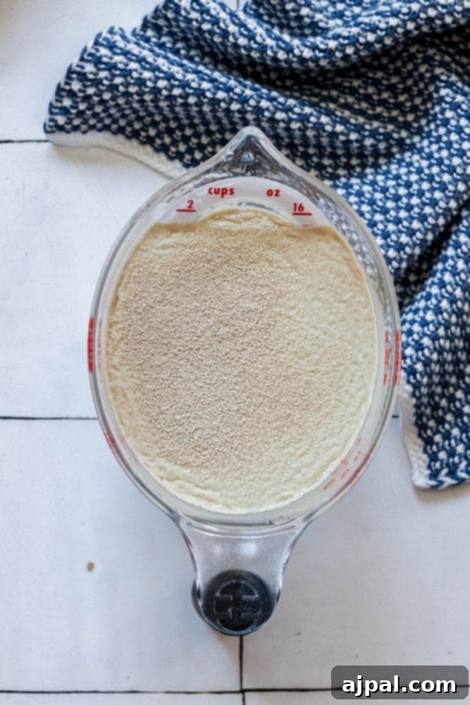 picture of yeast and water in a measuring cup 