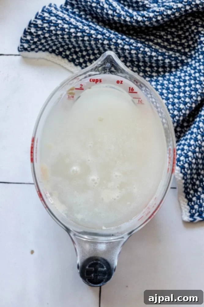 picture of yeast and water in a measuring cup