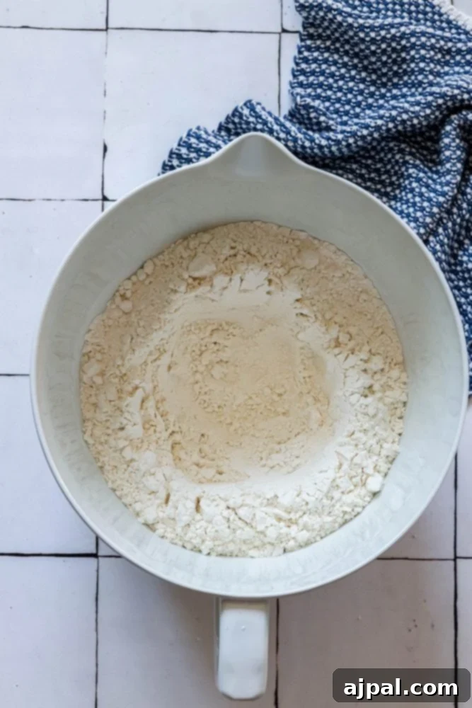 picture of flour in mixing bowl with a well formed in the middle