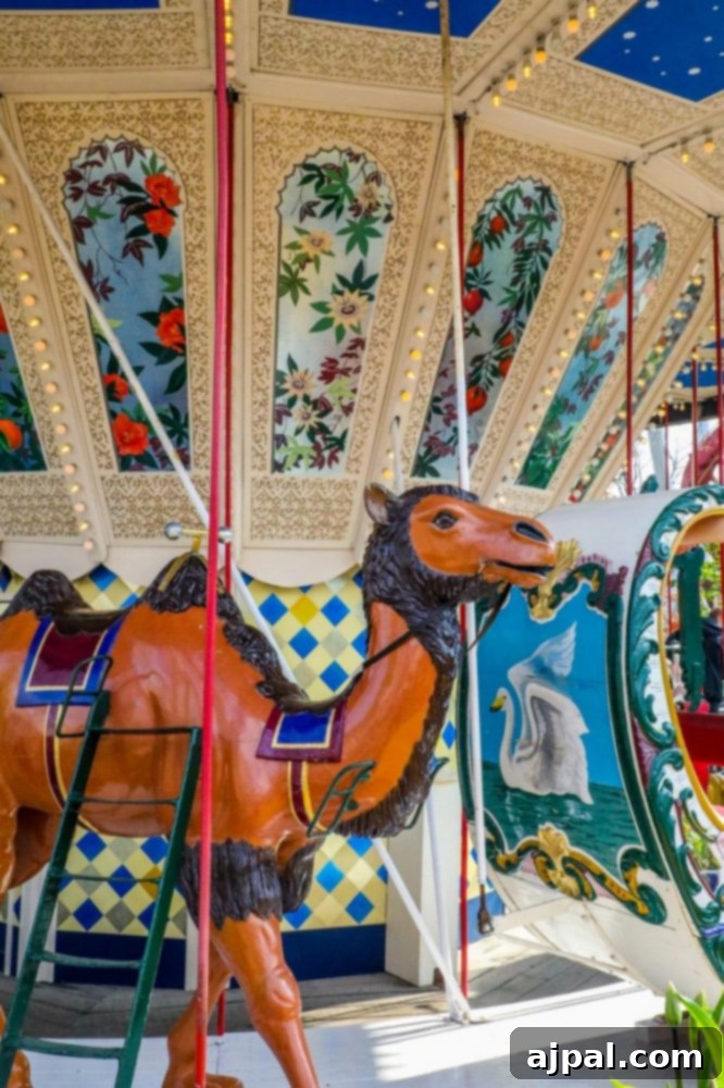 Tivoli Gardens Copenhagen Wonderland 13 A classic carousel featuring a majestic camel, a delightful ride in Tivoli Gardens, Copenhagen.