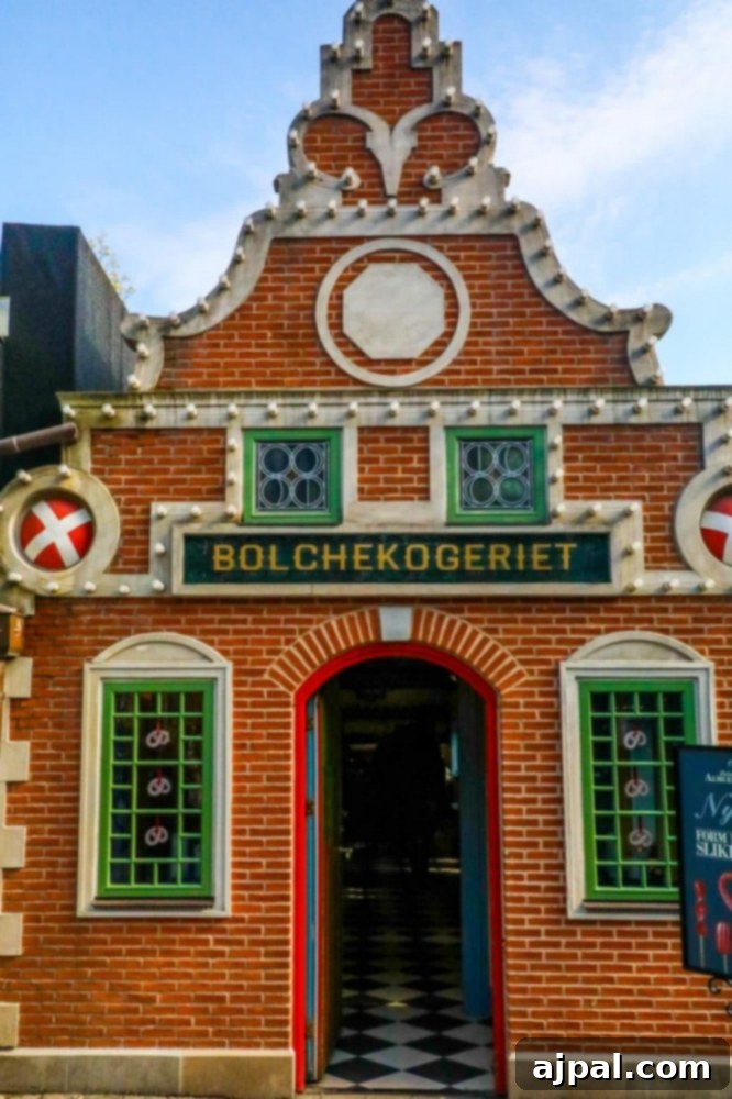Tivoli Gardens Copenhagen Wonderland 16 A historic red brick building within Tivoli Gardens, Copenhagen, showcasing the park's timeless architecture.