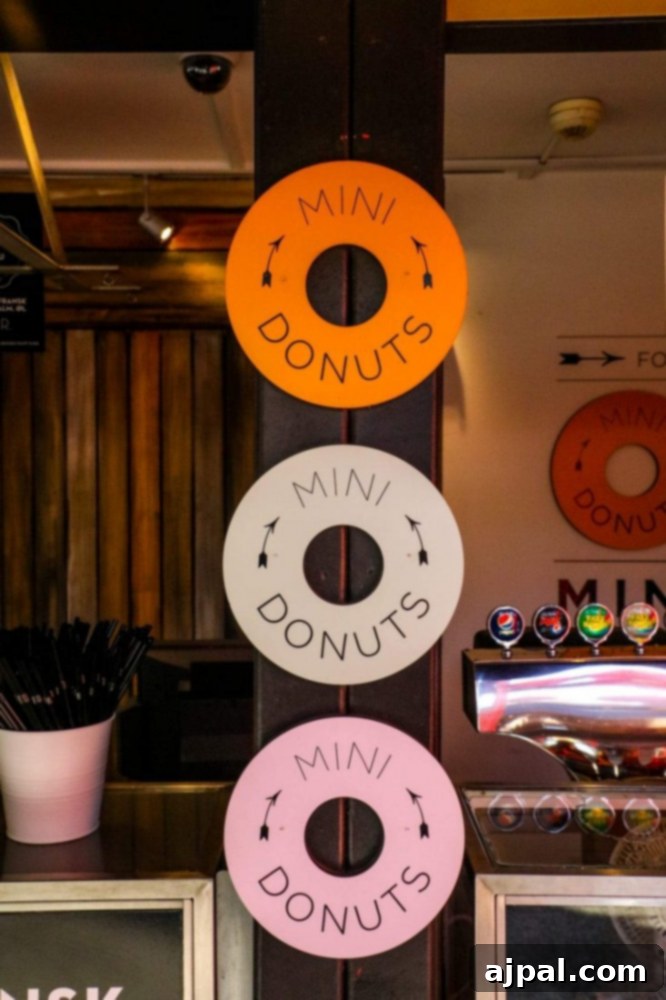 Tivoli Gardens Copenhagen Wonderland 22 A tempting display of fresh donuts on a counter at Tivoli Gardens, Copenhagen.