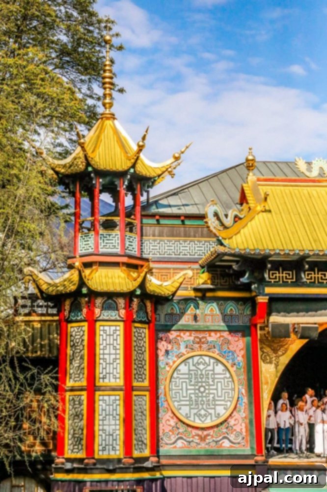 Tivoli Gardens Copenhagen Wonderland 28 The vibrant red and gold facade of a building in Tivoli Gardens, Copenhagen, radiating warmth and luxury.