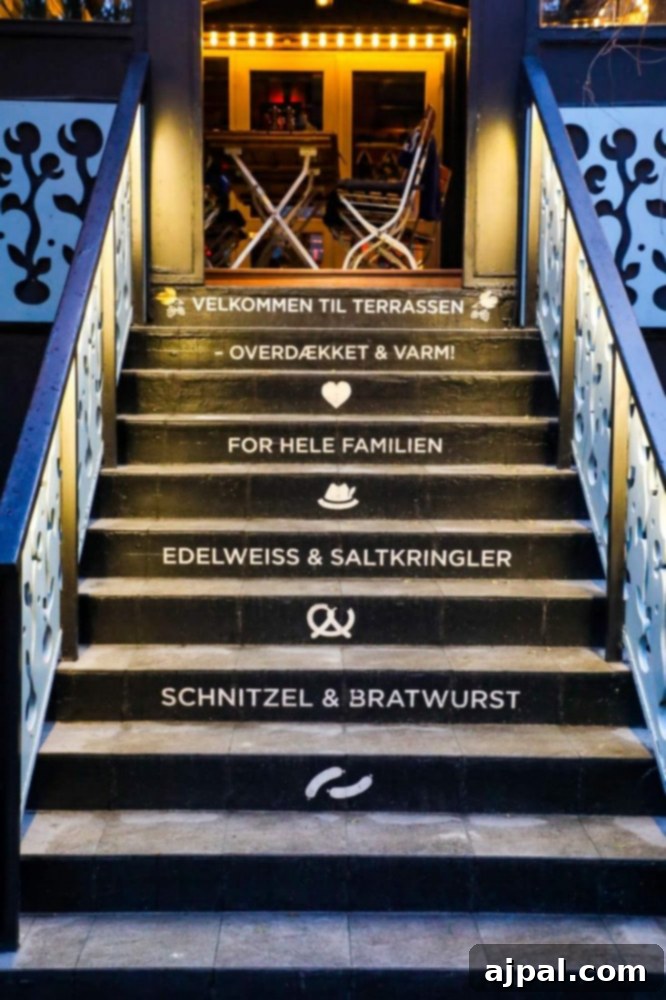 Tivoli Gardens Copenhagen Wonderland 5 A charming staircase leading to a restaurant at Tivoli Gardens in Copenhagen, amidst picturesque surroundings.