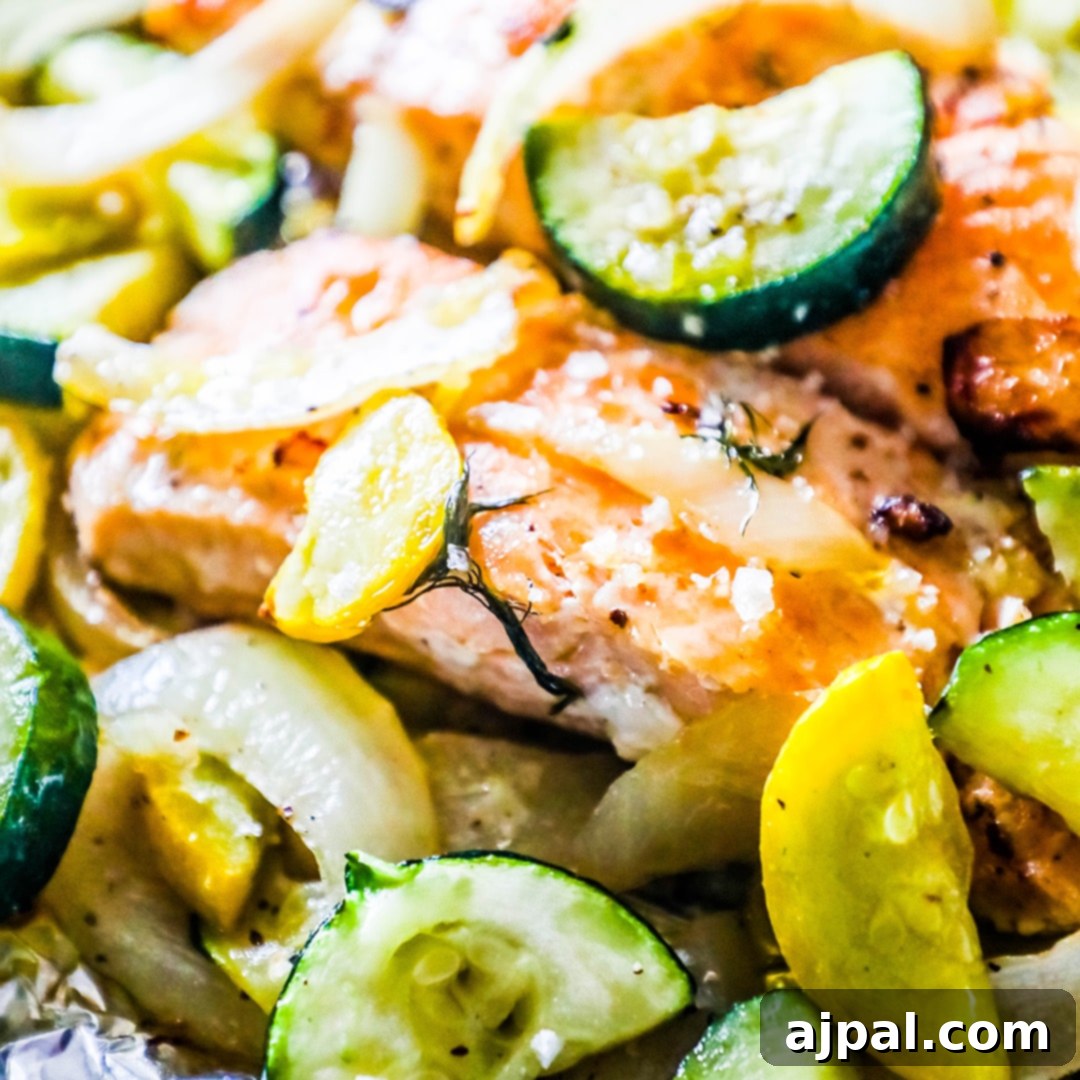 Garlic Herb Salmon and Zucchini Foil Packs 5 A perfectly cooked salmon fillet, generously coated with garlic and herbs, and surrounded by tender zucchini slices, all grilled and served directly from a foil packet.