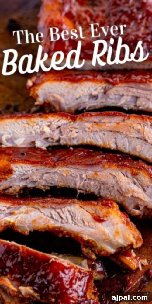 Perfectly Tender Oven Baked Ribs 12 A perfectly cooked rack of oven-baked ribs, glistening with sauce, served as the ultimate main course.