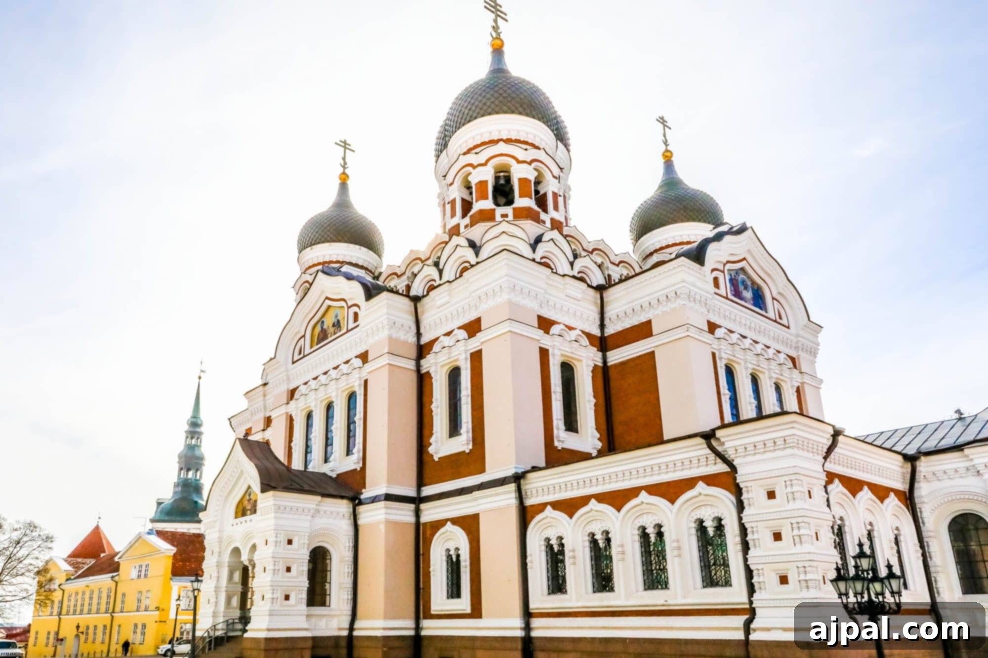 The Alexander Nevsky Cathedral in Tallinn, Estonia, a prominent Orthodox church with distinctive domes and vibrant exterior details, standing majestically on Toompea Hill.