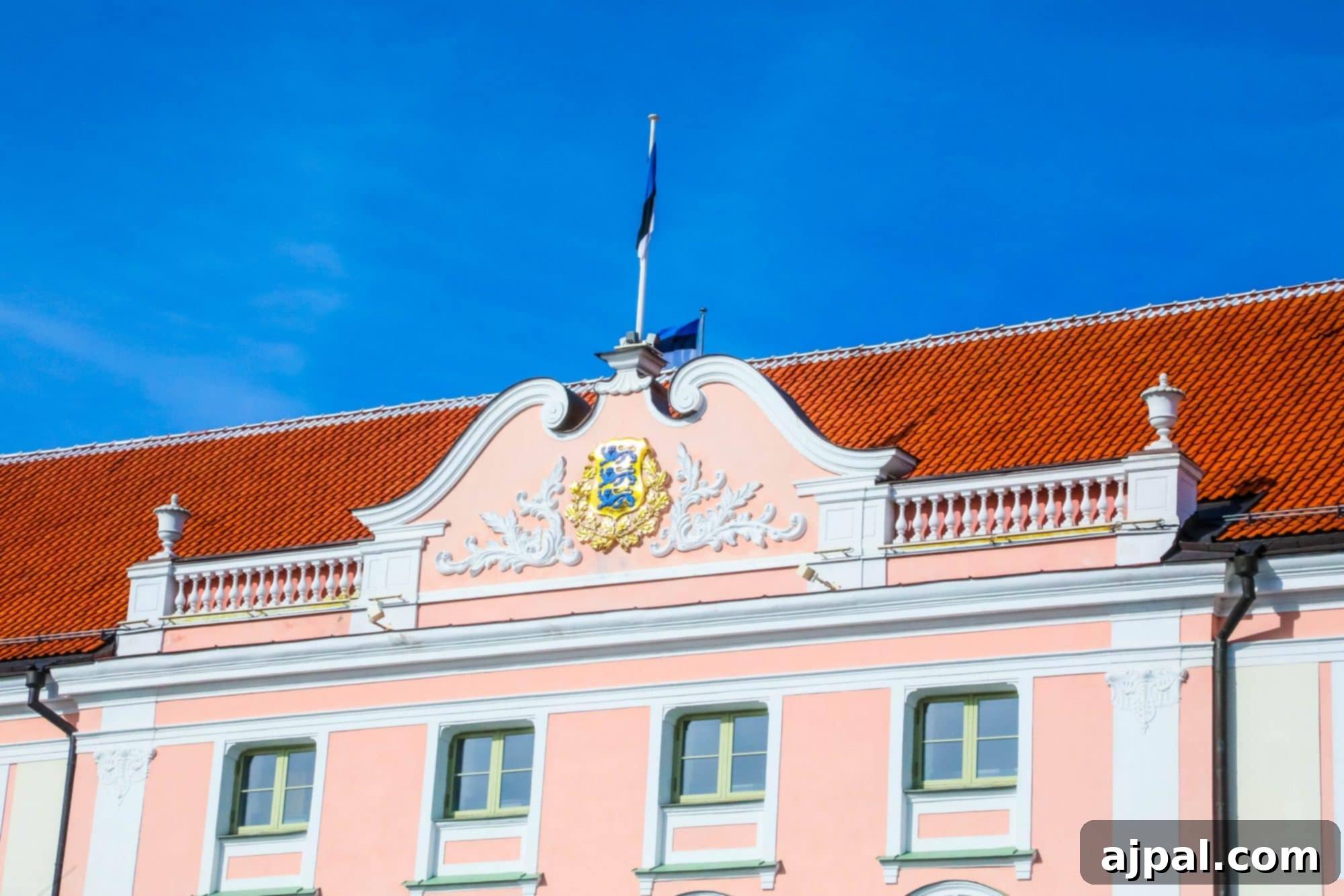 The distinctive pink facade of the Estonian Parliament Building in Tallinn, a key governmental landmark in the city's Upper Old Town.