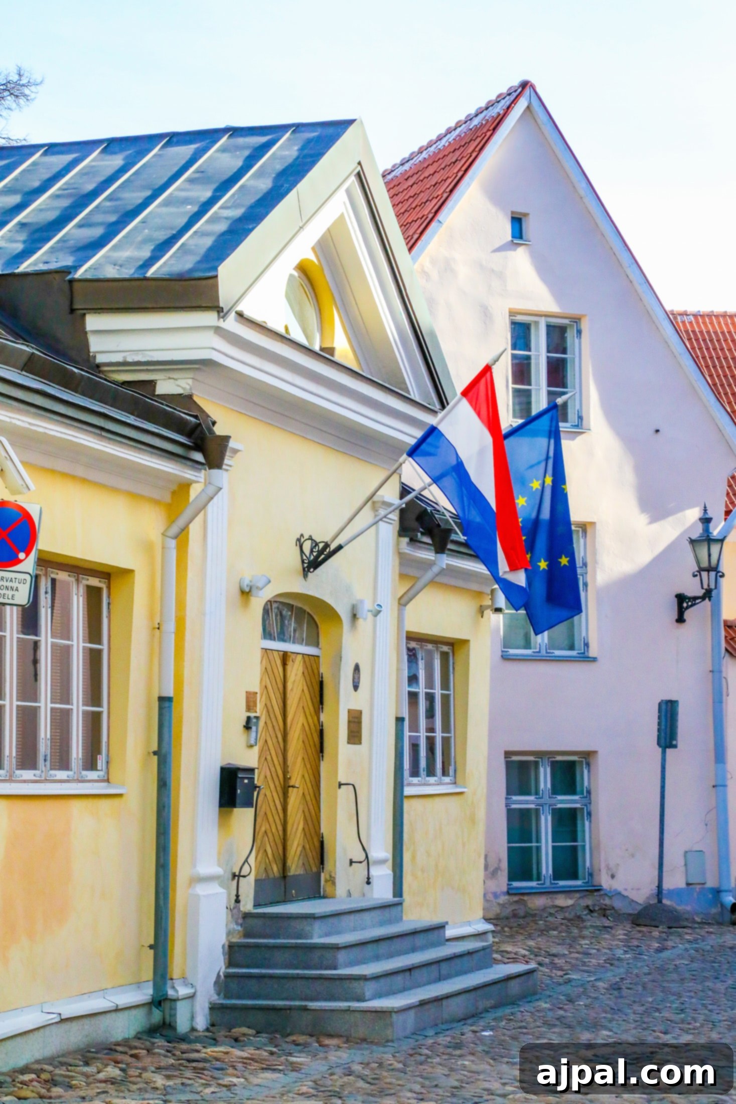 A beautiful yellow building on Embassy Row in Tallinn, Estonia, showcasing elegant architecture.