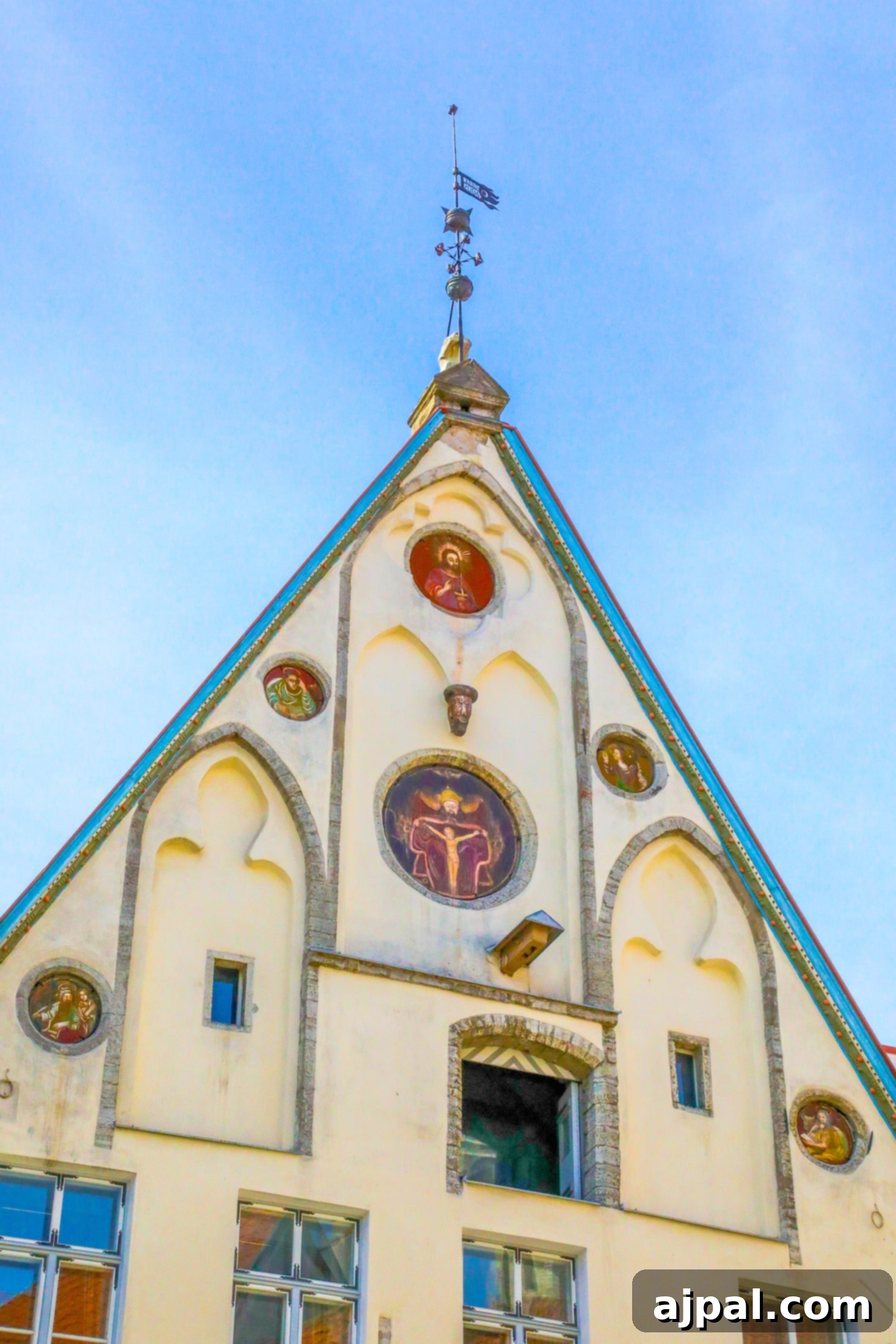 A tall historic church in Tallinn, Estonia, featuring a prominent clock tower, a testament to the city's rich architectural heritage.