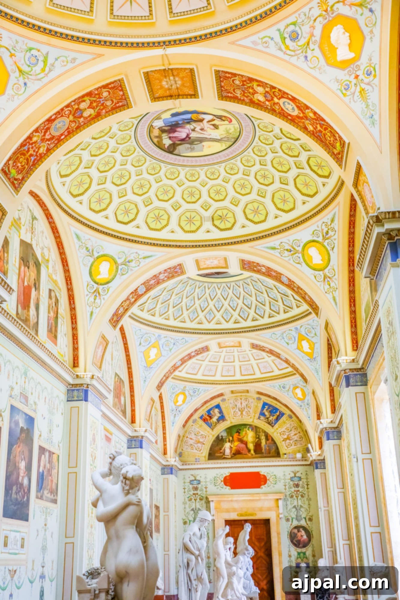 An ornately decorated room featuring classical statues and intricate paintings, part of a Princess Cruises Saint Petersburg shore excursion.