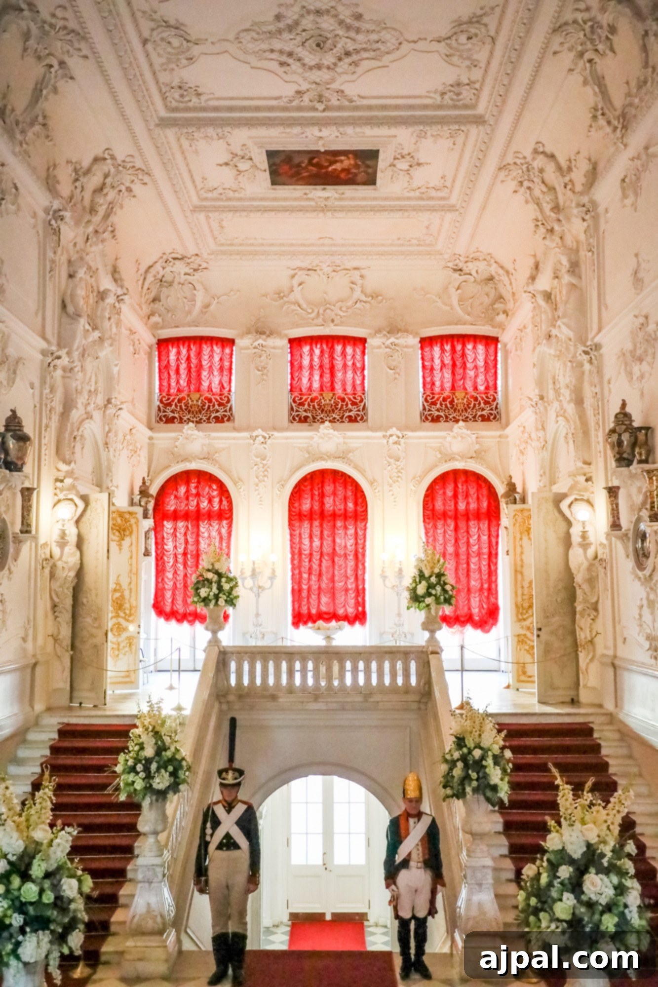 An ornate building with rich red curtains inside, a private tour of Catherine’s Palace Saint Petersburg.