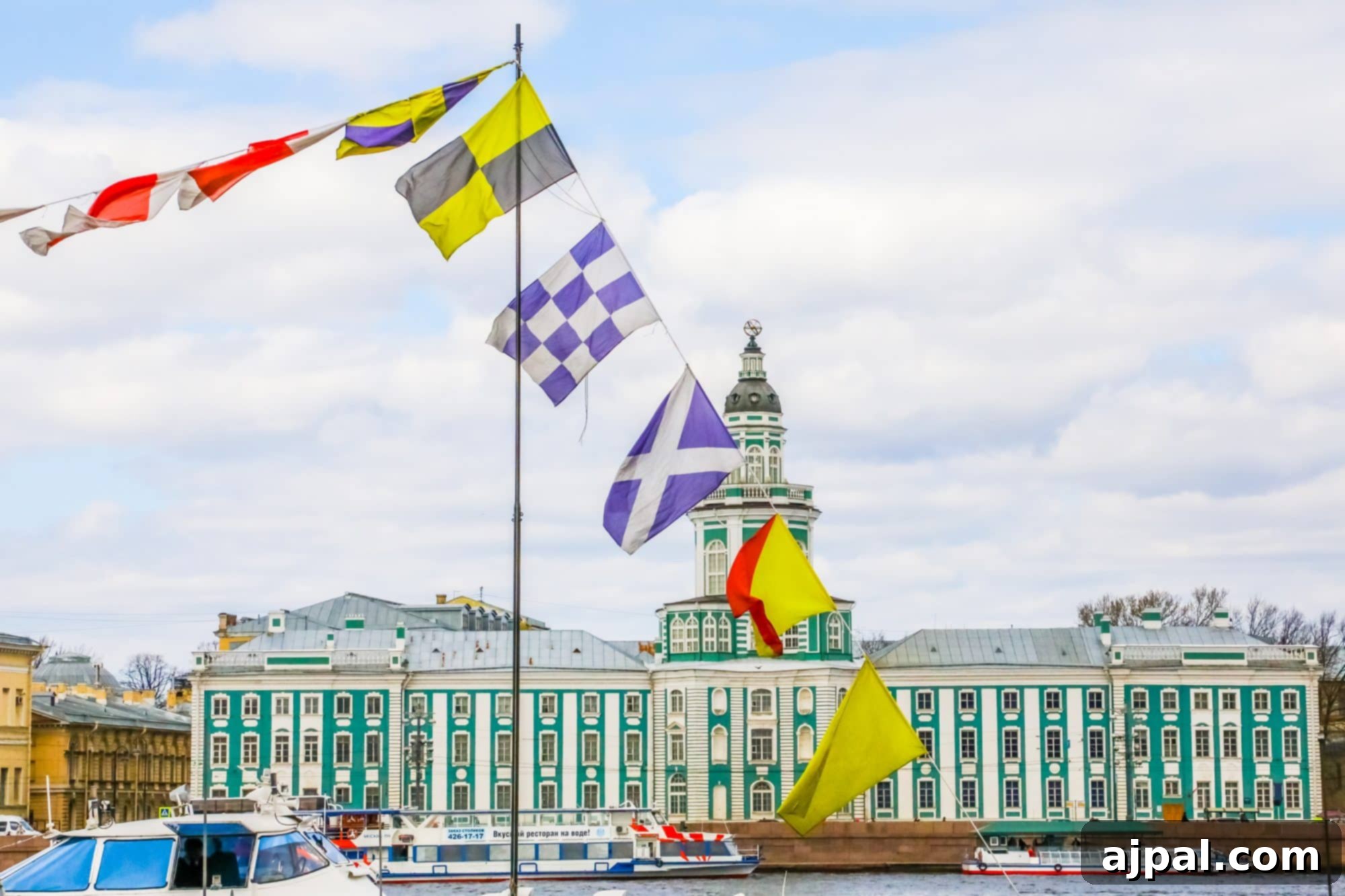 Flags fluttering over a ship on the Neva River in Saint Petersburg, a highlight of the Ultimate Saint Petersburg Shore Excursion.