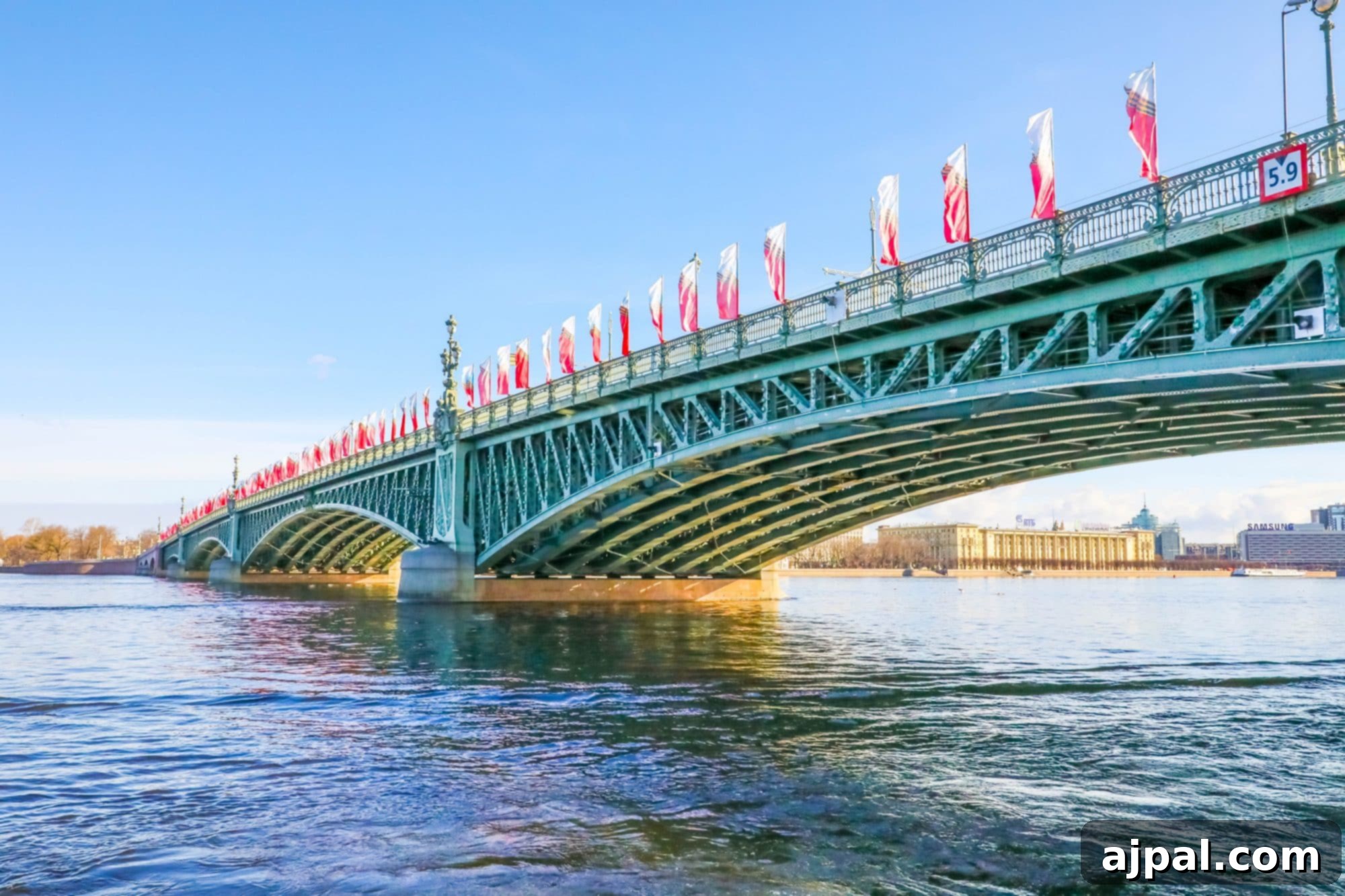 A picturesque bridge over a river, adorned with flags during a Princess Cruises Saint Petersburg shore excursion.