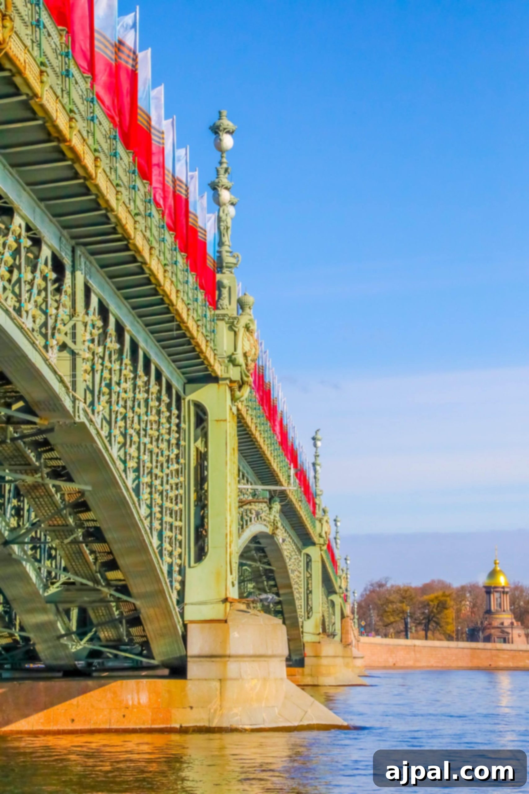 A river bridge magnificently adorned with flags, offering a vibrant sight for a Saint Petersburg shore excursion.