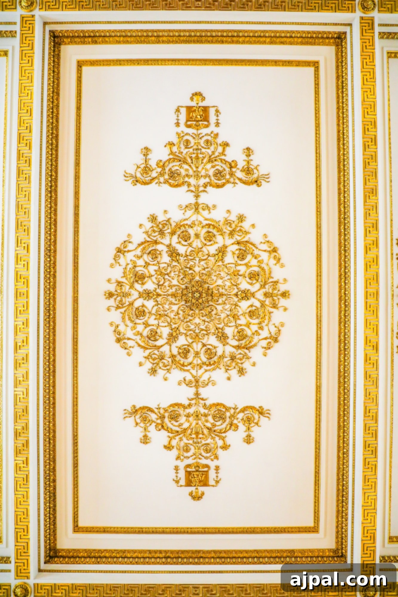 An exquisitely ornate gold ceiling adorns a room, a feature of the Princess Cruises Russia Ultimate Saint Petersburg Shore Excursion.