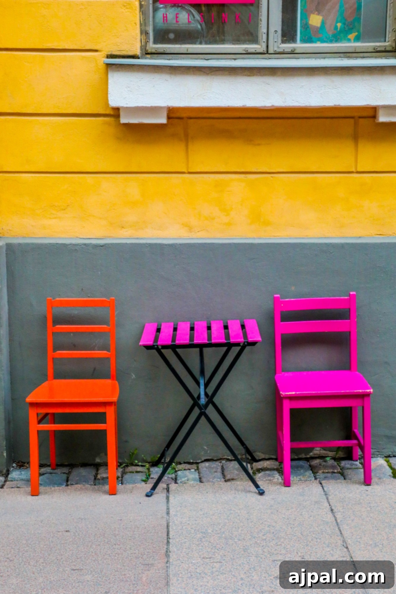 Colorful chairs and tables invite passersby to relax outside an artisan market in Helsinki, Finland.