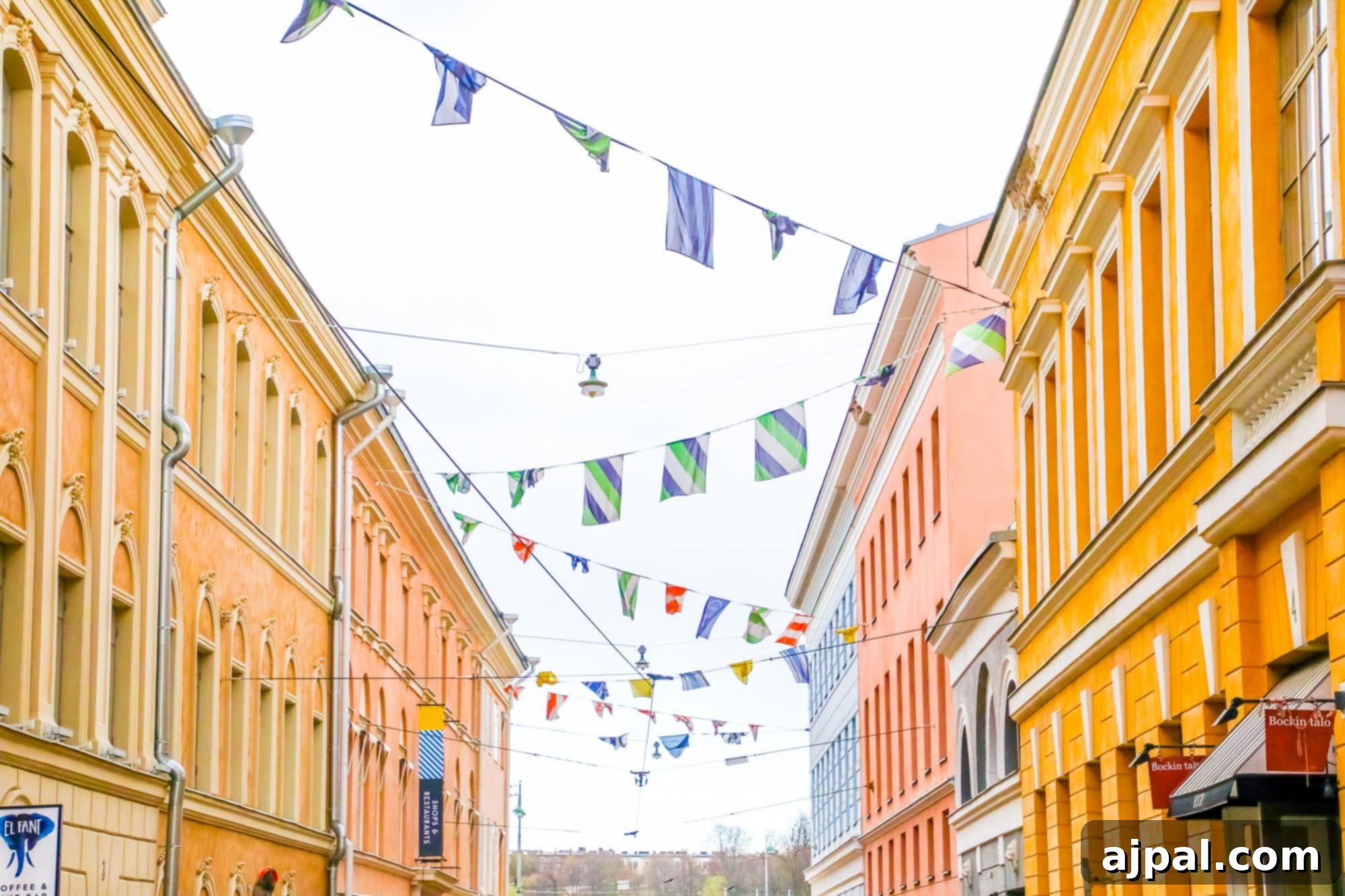A vibrant street scene in Helsinki, adorned with festive bunting, reflecting the city's lively atmosphere.