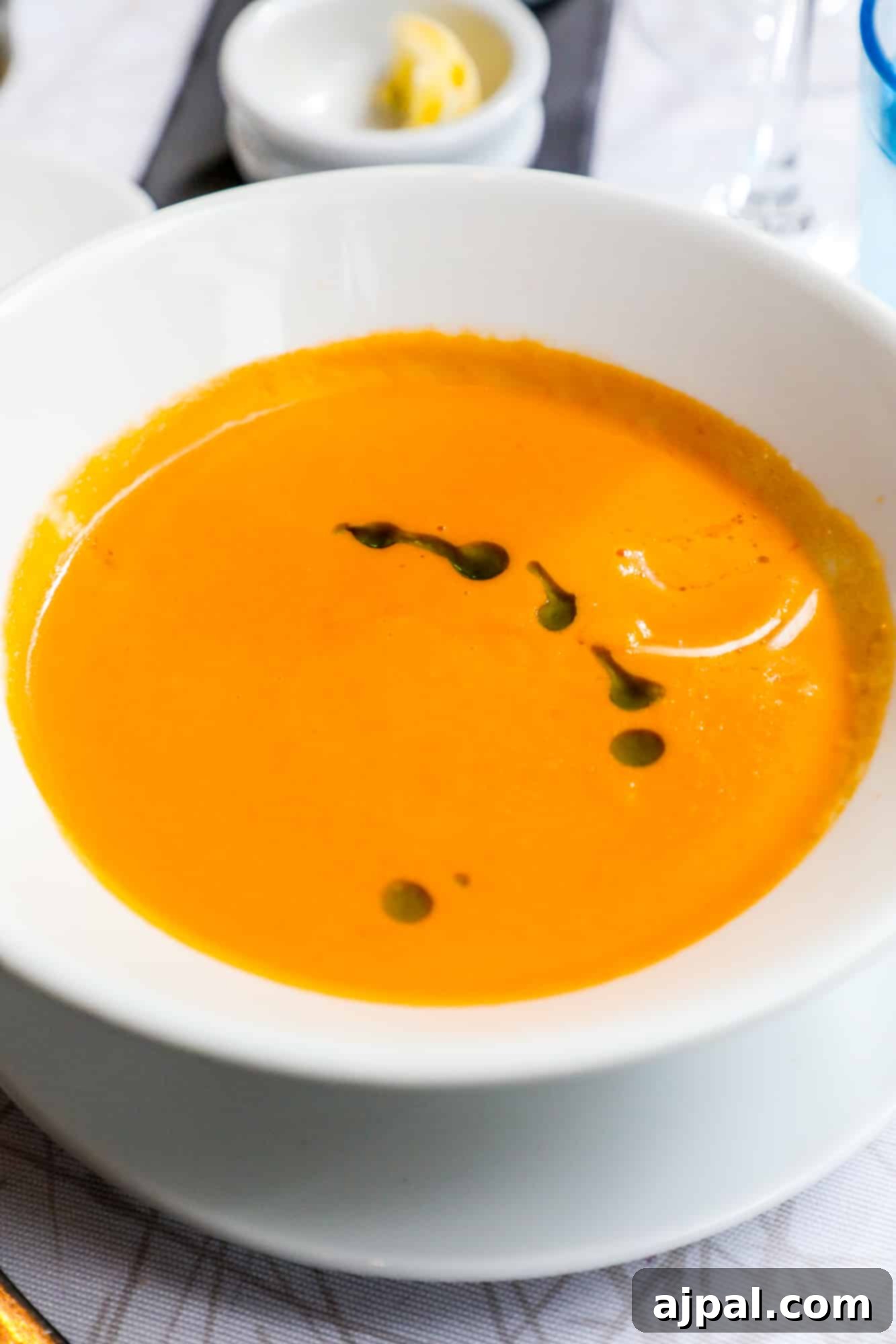 A vibrant bowl of asparagus and crab soup, a creamy and flavorful delight from Kappeli Restaurant in Helsinki.