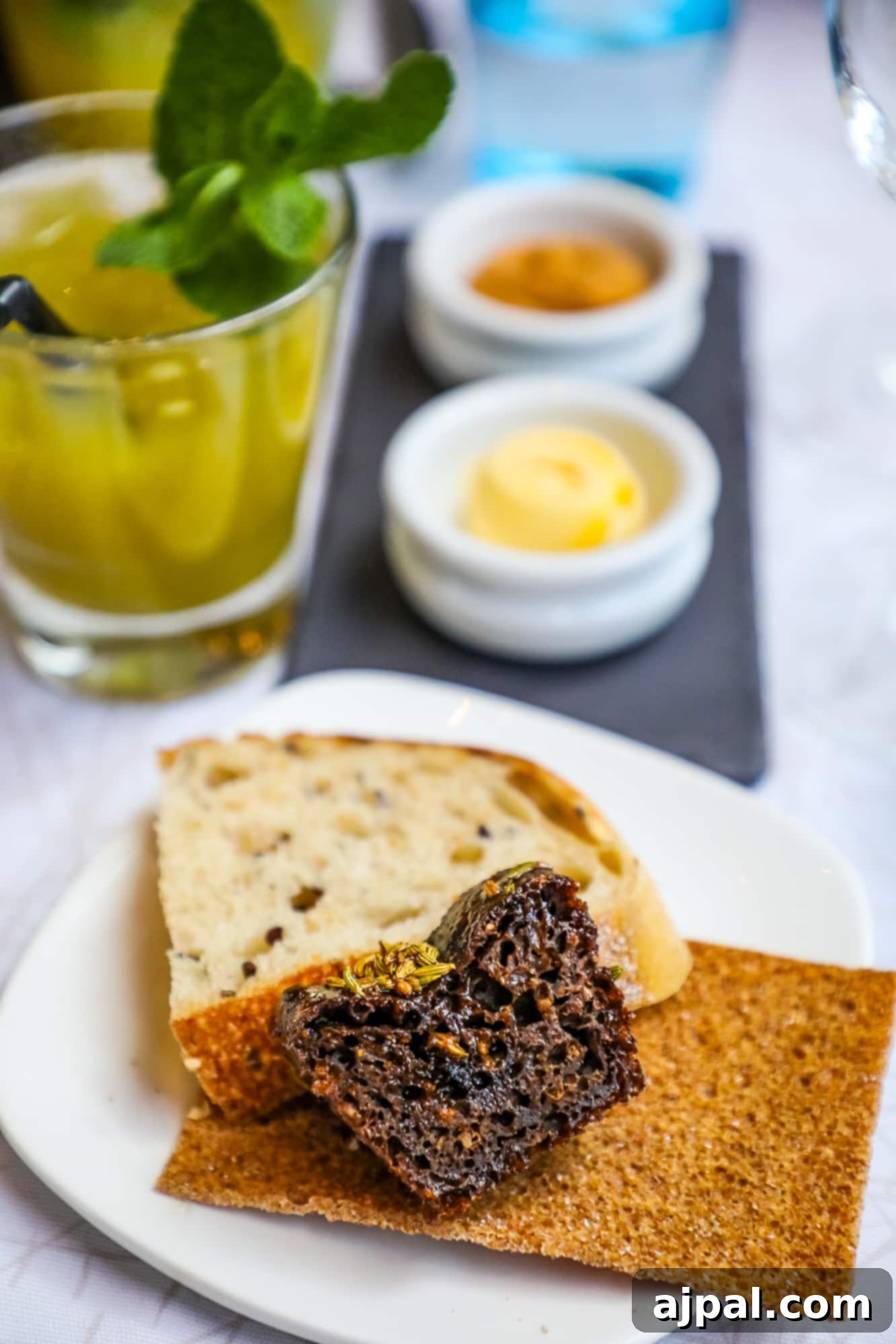 A selection of artisanal rye breads served with butter at Kappeli Restaurant in Helsinki.