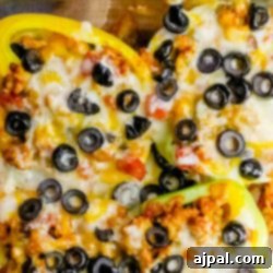 Mexican stuffed taco peppers with chicken, baked in a glass dish, a delicious and healthy dinner option.