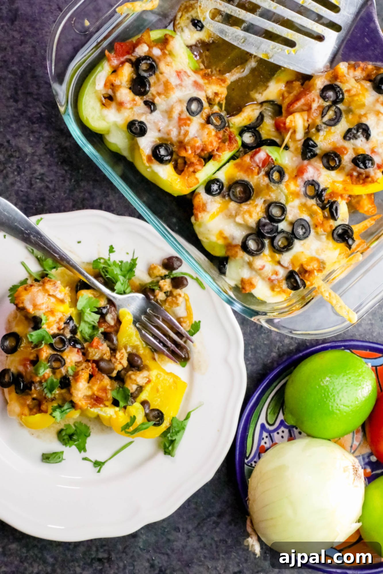 A single, perfectly baked chicken taco stuffed pepper on a white plate, highlighting the rich filling and melted cheese.